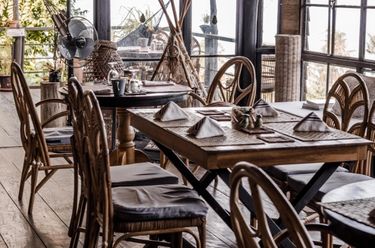 Interior of restaurant called the Nesting Table El Nido at glamping boutique hotel The Birdhouse in El Nido, Philippines 