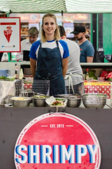 Founder of Shrimpy, a London food stall specialising in shrimp burgers poses for the photo at her food stall in Hackney, London