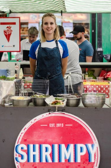 Founder of Shrimpy, a London food stall specialising in shrimp burgers poses for the photo at her food stall in Hackney, London