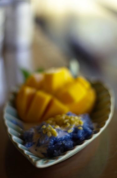Mango sticky rice in a plate on a table