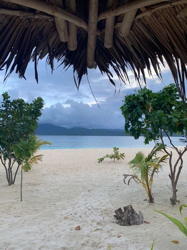 View from a bamboo hut of sandy beaches and sea