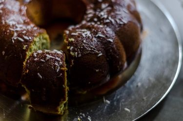 Close up of bundt cake with a slice if cake