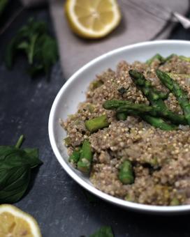 A plate with buckwheat and asparagus surrounded by lemon and mint 