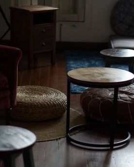 A cost setting with sofas and cushions in a cafe's reading areas