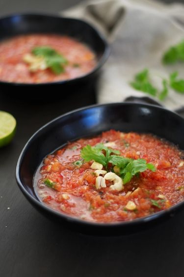 Close up shot of two bowls filled with watermelon gazpacho