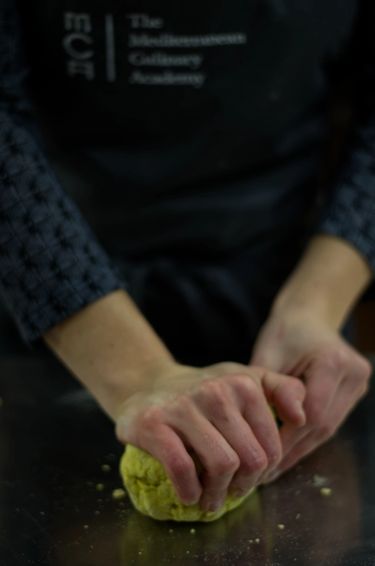 Hands kneading a dough