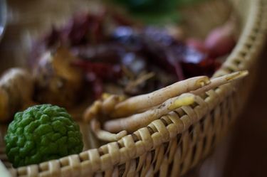 Close up shot of Asian spices in a bamboo basket