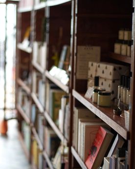Shelf stacked with books and gifts