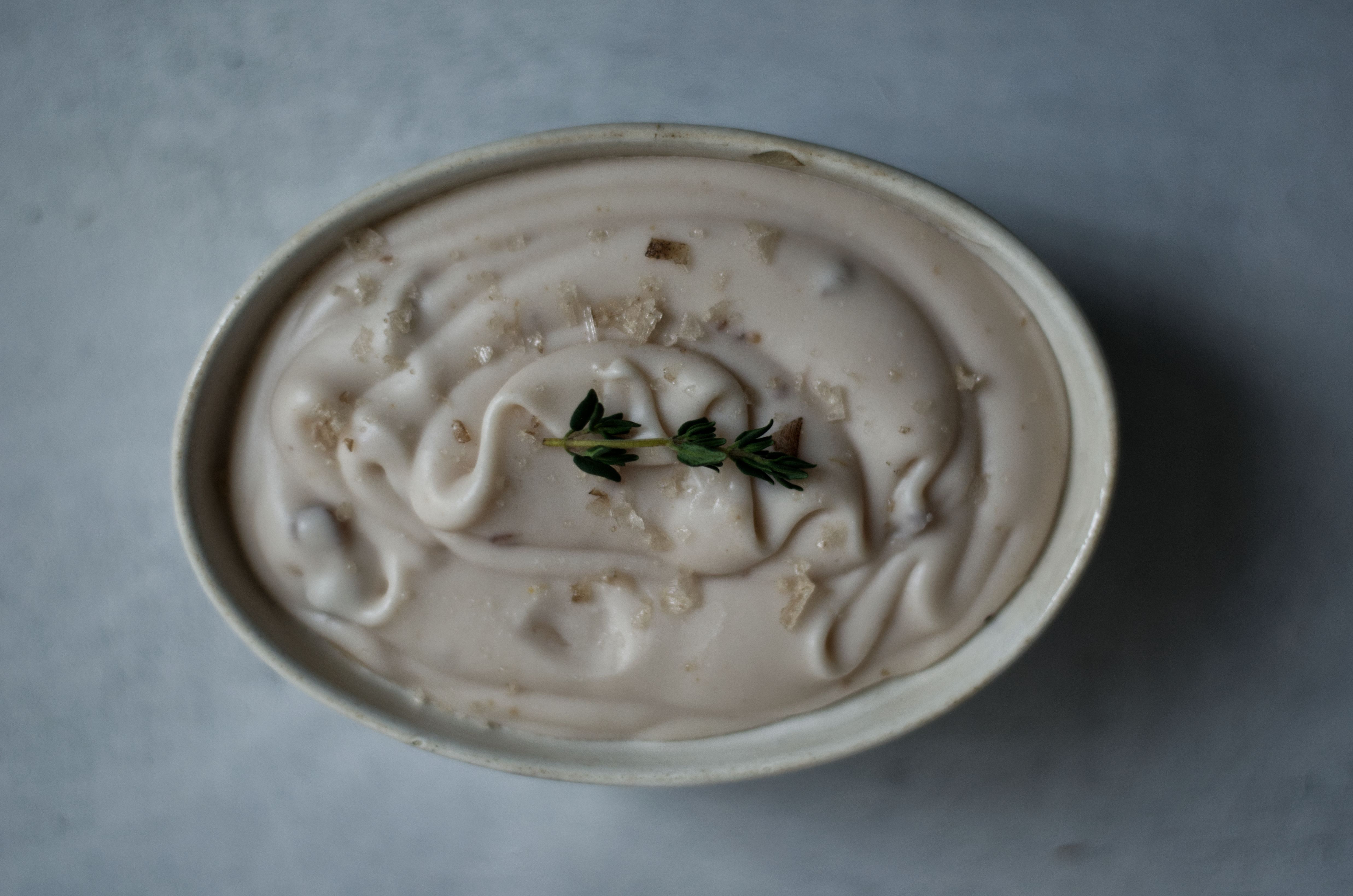 Overhead picture of homemade vegan butter on a blue background