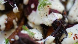 Close up of a carrot and beet salad with yoghurt dressing
