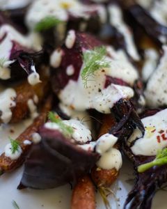 Close up of a carrot and beet salad with yoghurt dressing