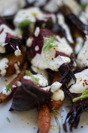 Close up of a carrot and beet salad with yoghurt dressing