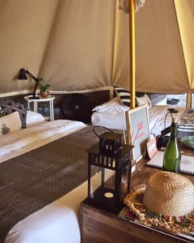 Bed in a tent at glamping boutique hotel The Birdhouse in El Nido, Philippines