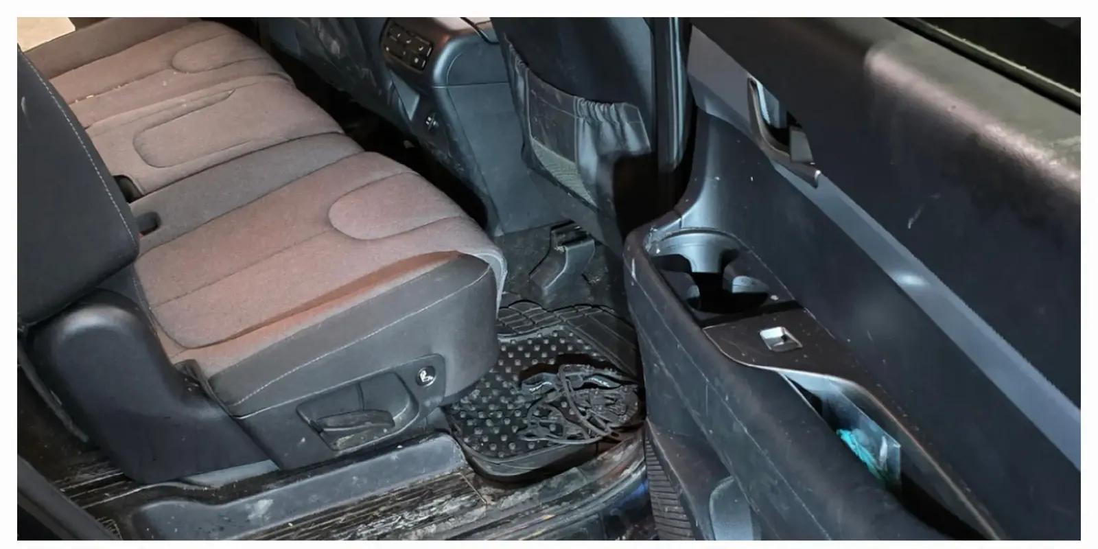 SUV rear seat and door panel soiled before interior detailing in Anchorage, Alaska