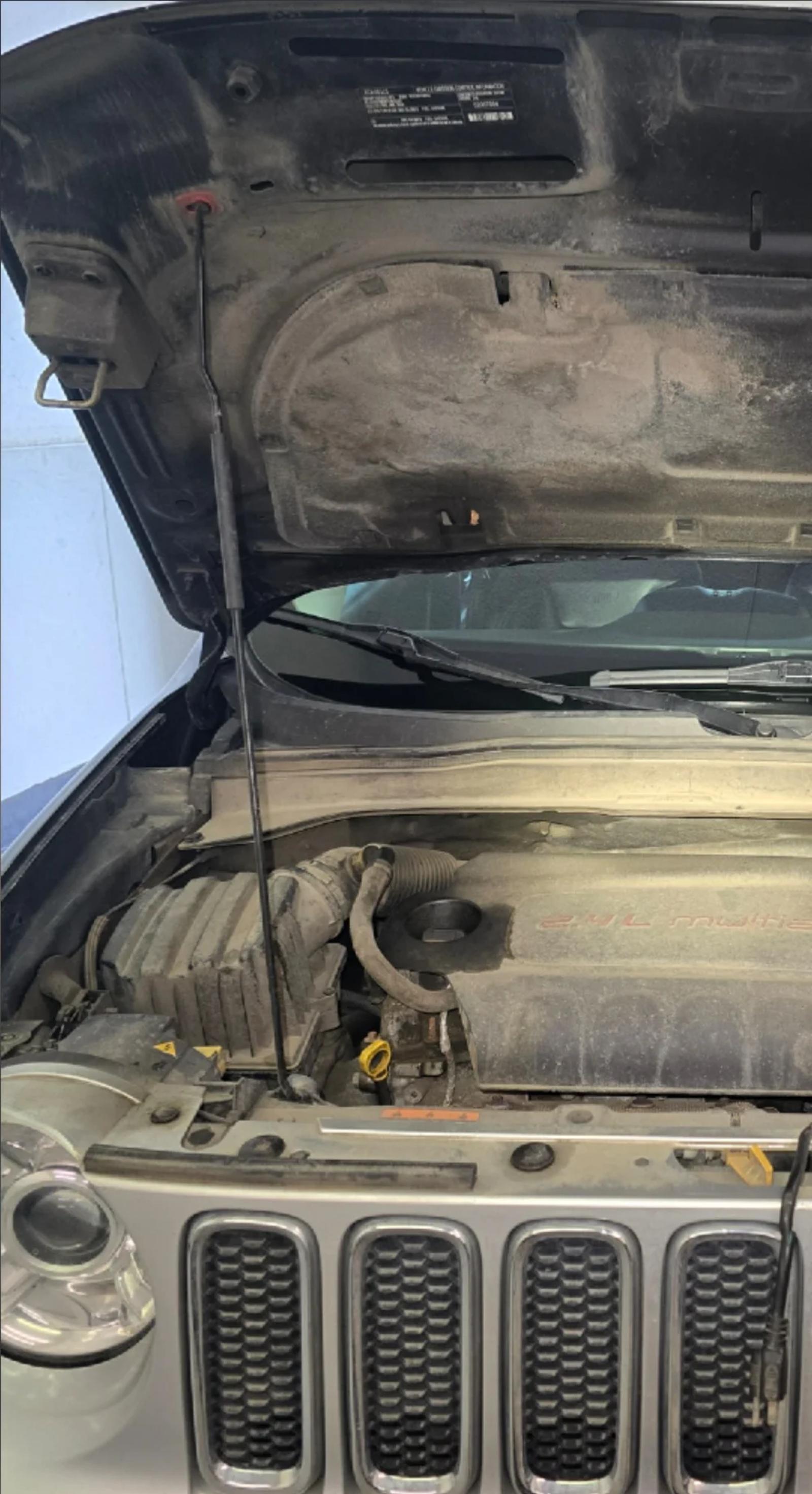 Jeep Renegade engine bay before cleaning in Anchorage, Alaska