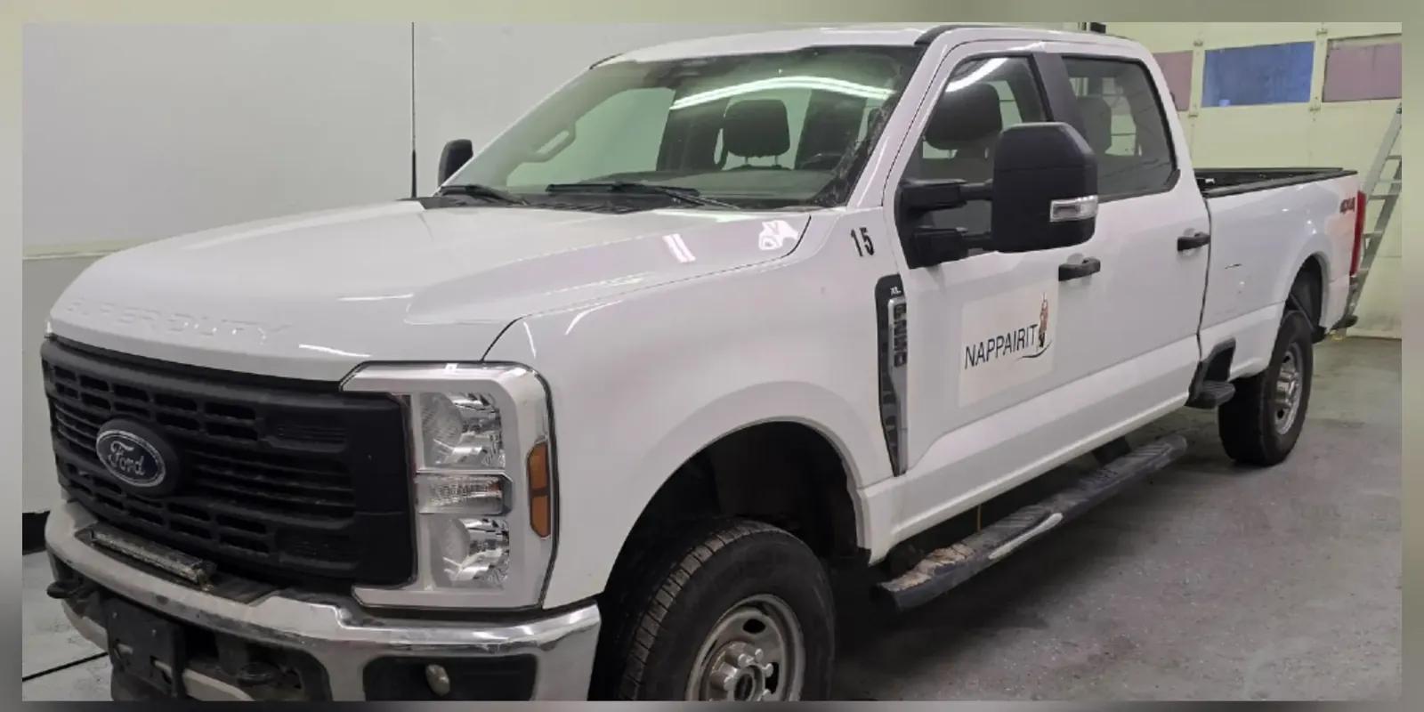 White Ford F-250 Super Duty fleet truck dirty before exterior detailing in Anchorage, Alaska