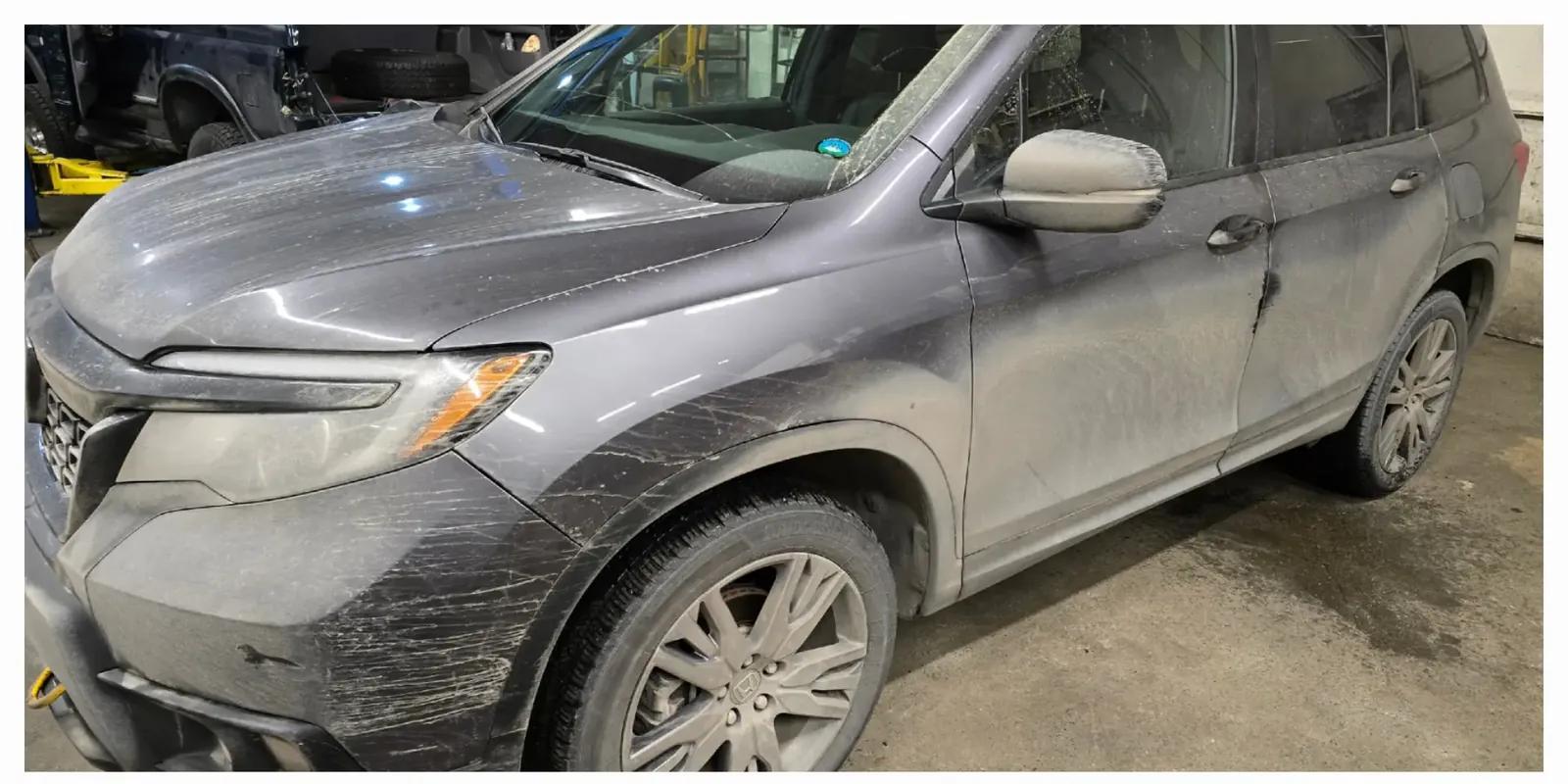 Honda Passport covered in road salt and mud before exterior detailing in Anchorage, Alaska