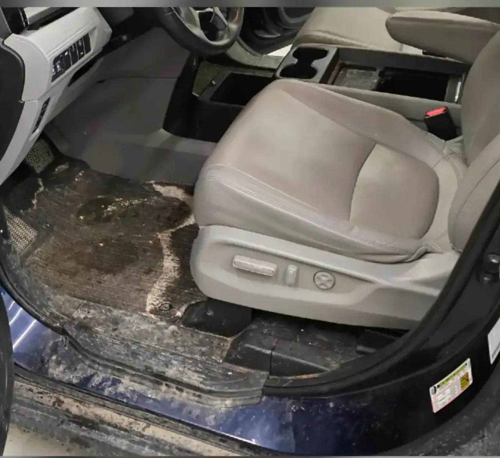 Honda Odyssey driver footwell caked with mud and salt before interior detailing in Anchorage, Alaska