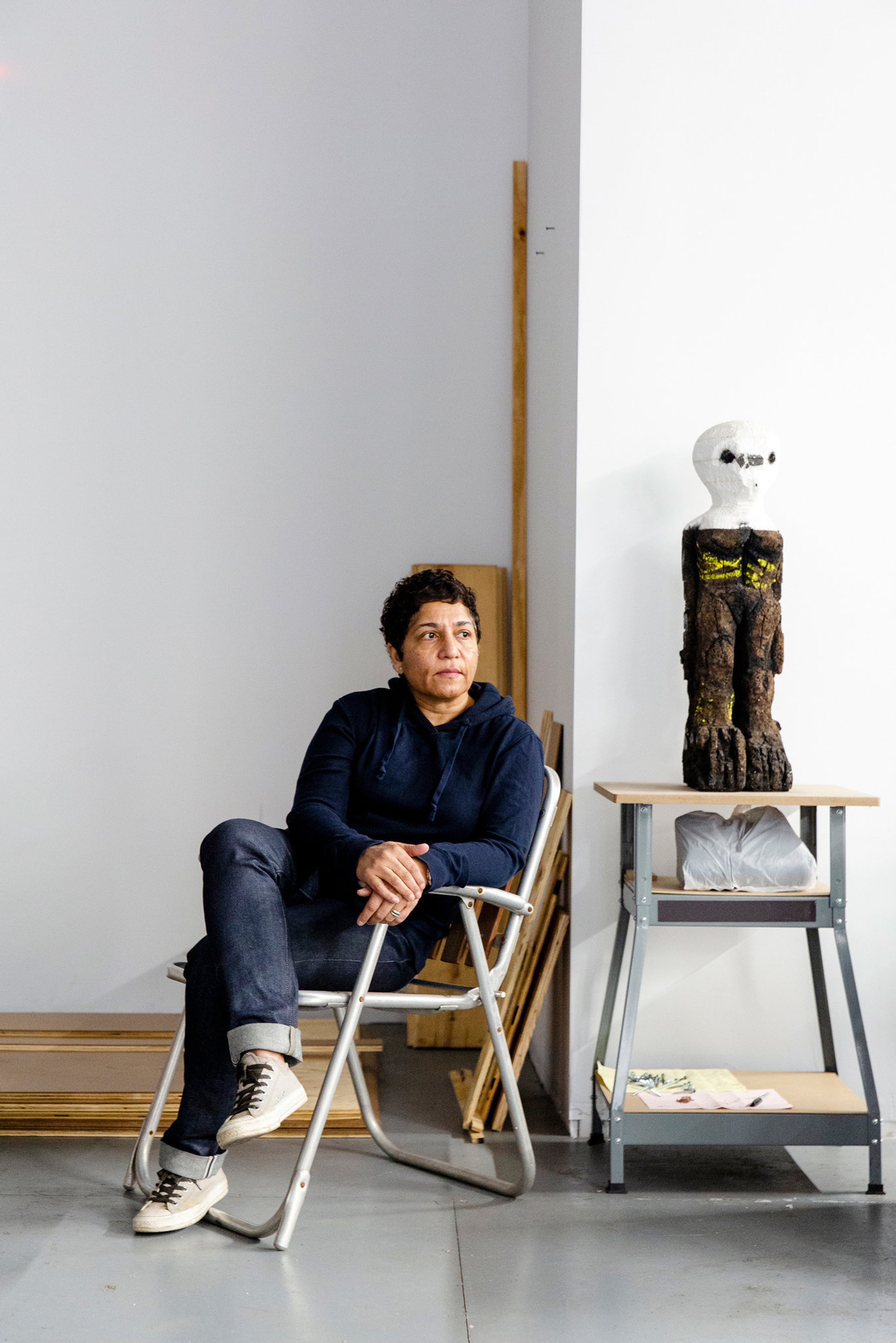 The artist Huma Bhabha photographed in her Poughkeepsie, N.Y., studio, alongside one of her sculptures. Photo: Eva Deitch.