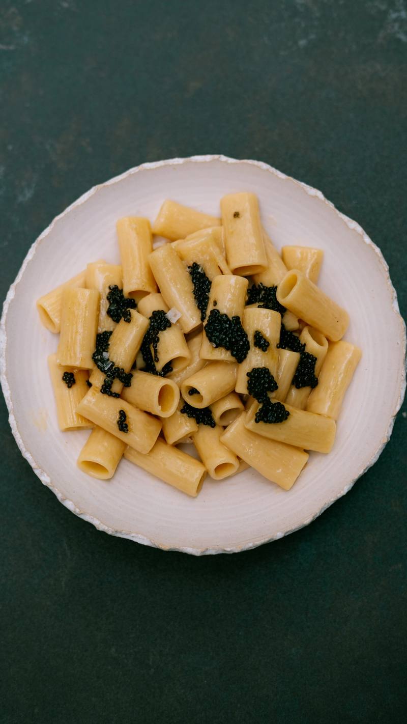 Plate of rigatoni with caviar seen from above