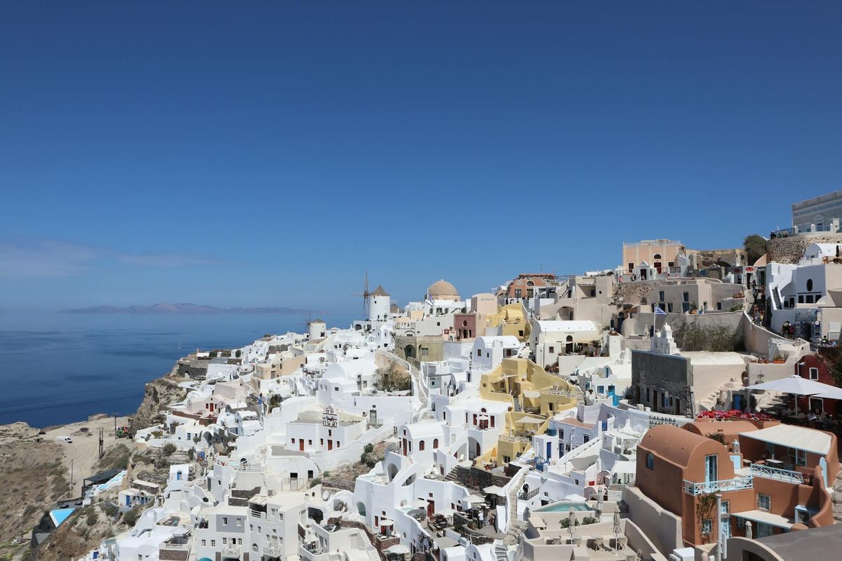 Stunning view of Santorini's white buildings against the Aegean Sea in Oia, Greece.