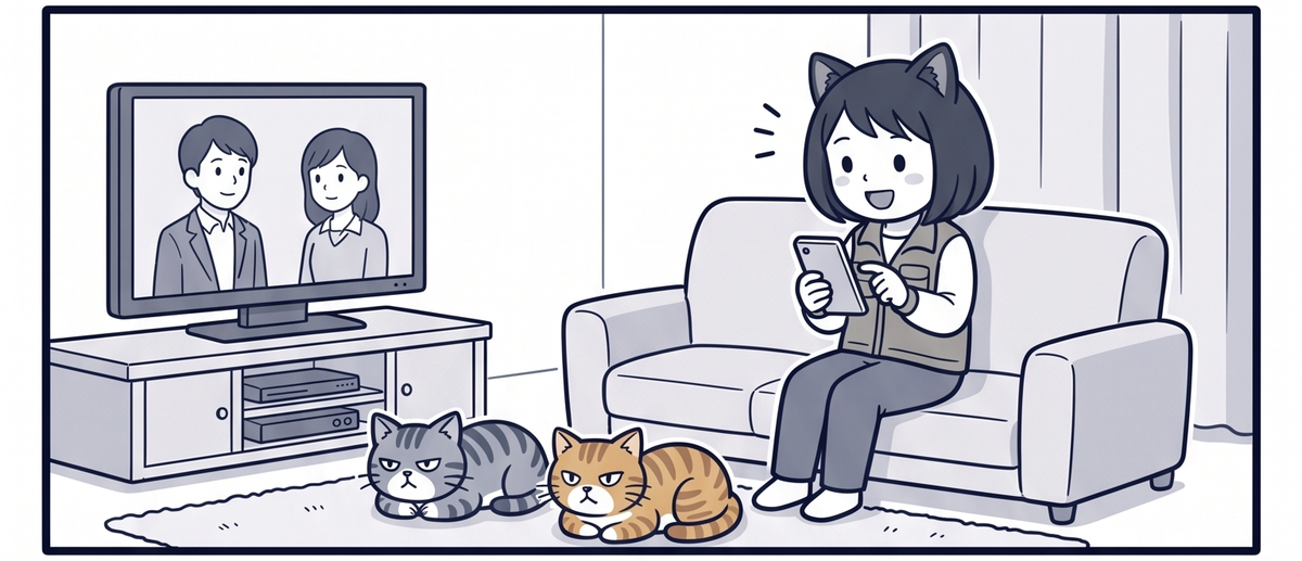 ソファでスマホゲームを遊ぶママと猫2匹