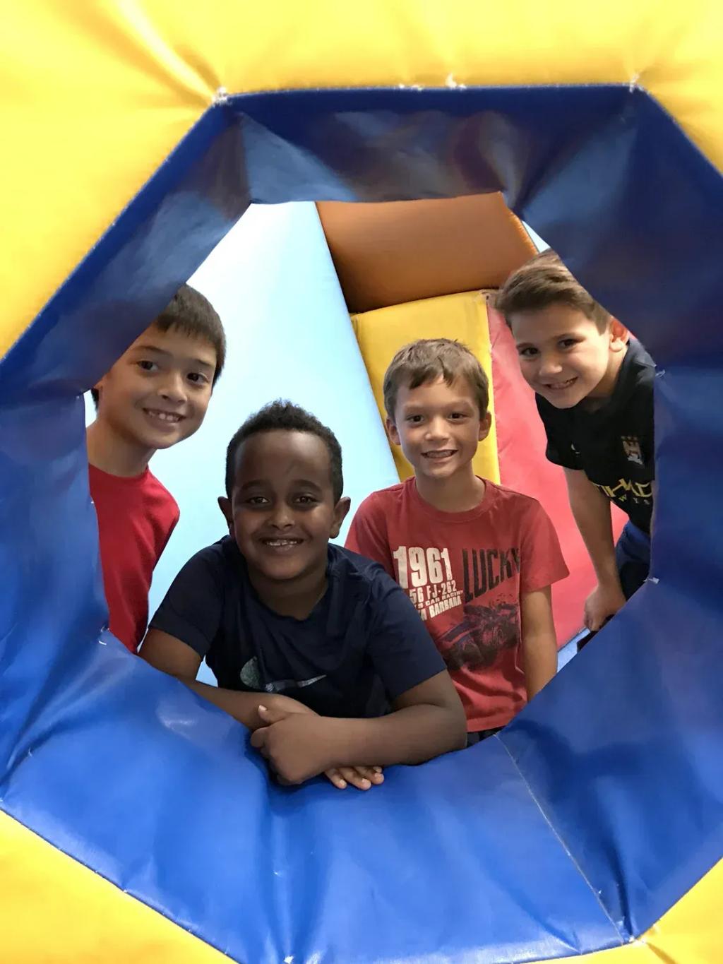 Boy training on the octagon mat in a Brown's boys gymnastics class