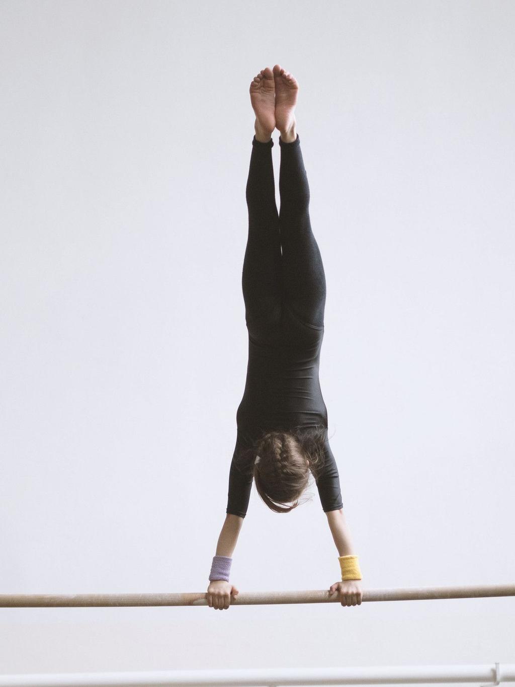 Go For It USA gymnast in a confident finish pose