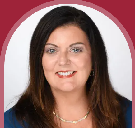 Headshot of Deborah Thompson, VP of Enrollment Management at Flagler College, framed in an arch on a crimson background