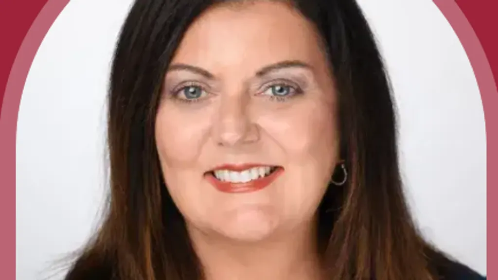 Headshot of Deborah Thompson, VP of Enrollment Management at Flagler College, framed in an arch on a crimson background