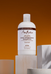 A bottle of SheaMoisture 100% Virgin Coconut Oil Daily Hydration Shampoo
