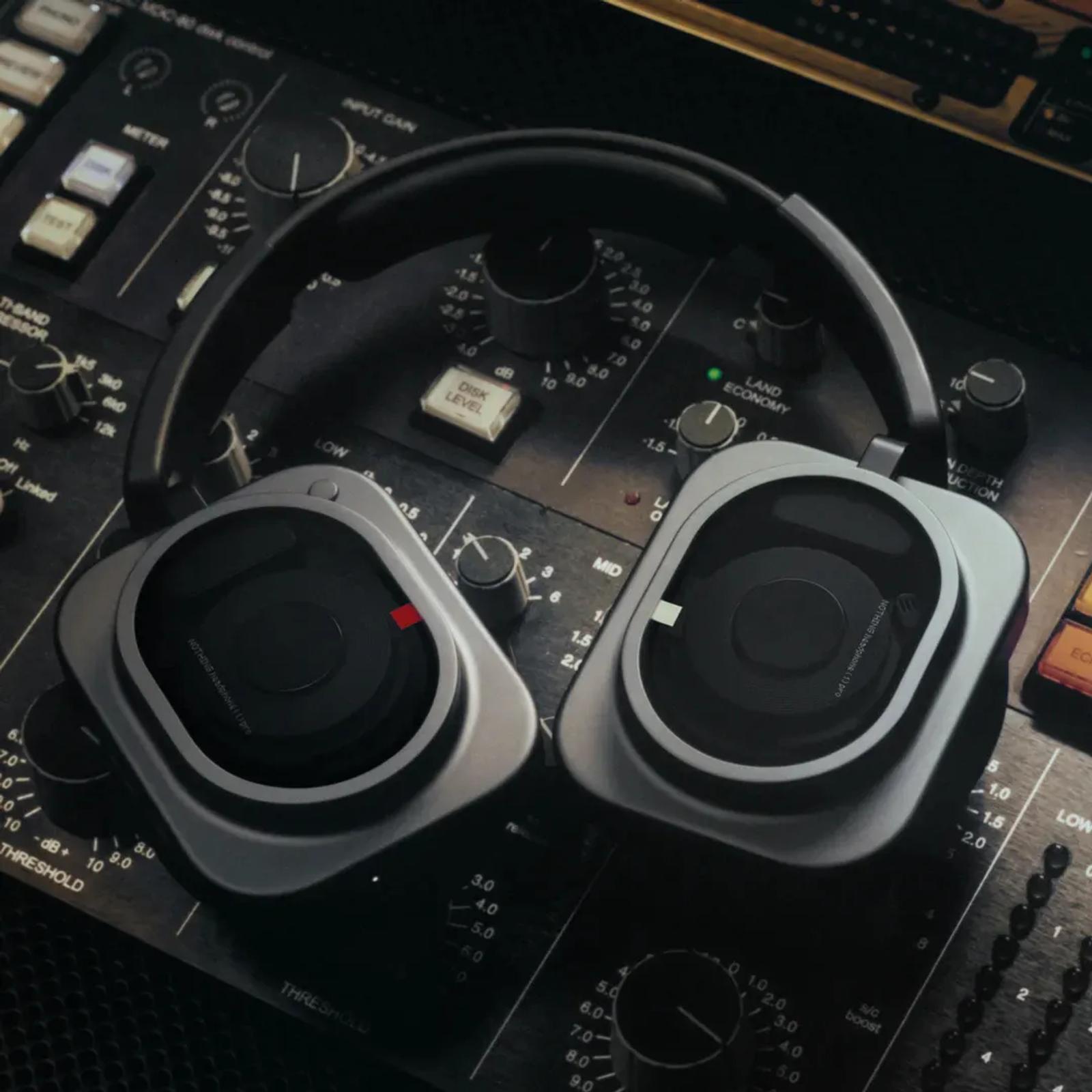 Pair of Nothing Headphone (1) Pro over-ears seen from above on a mixing console