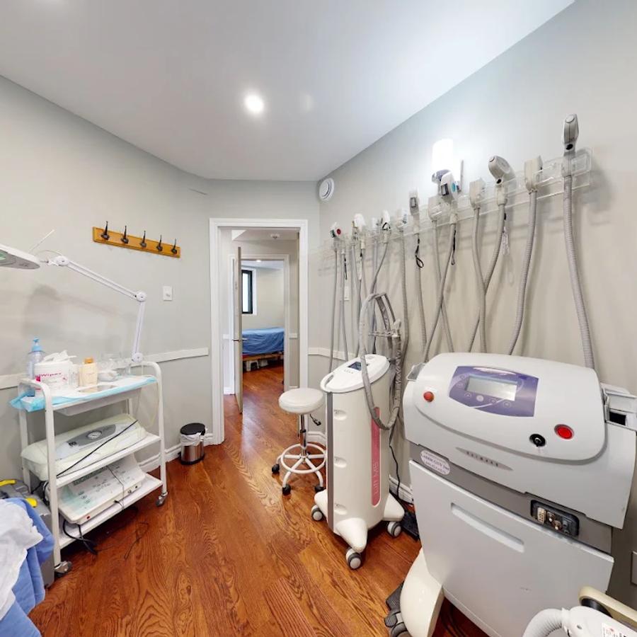 Treatment handpieces racked along the wall of a clinic room.