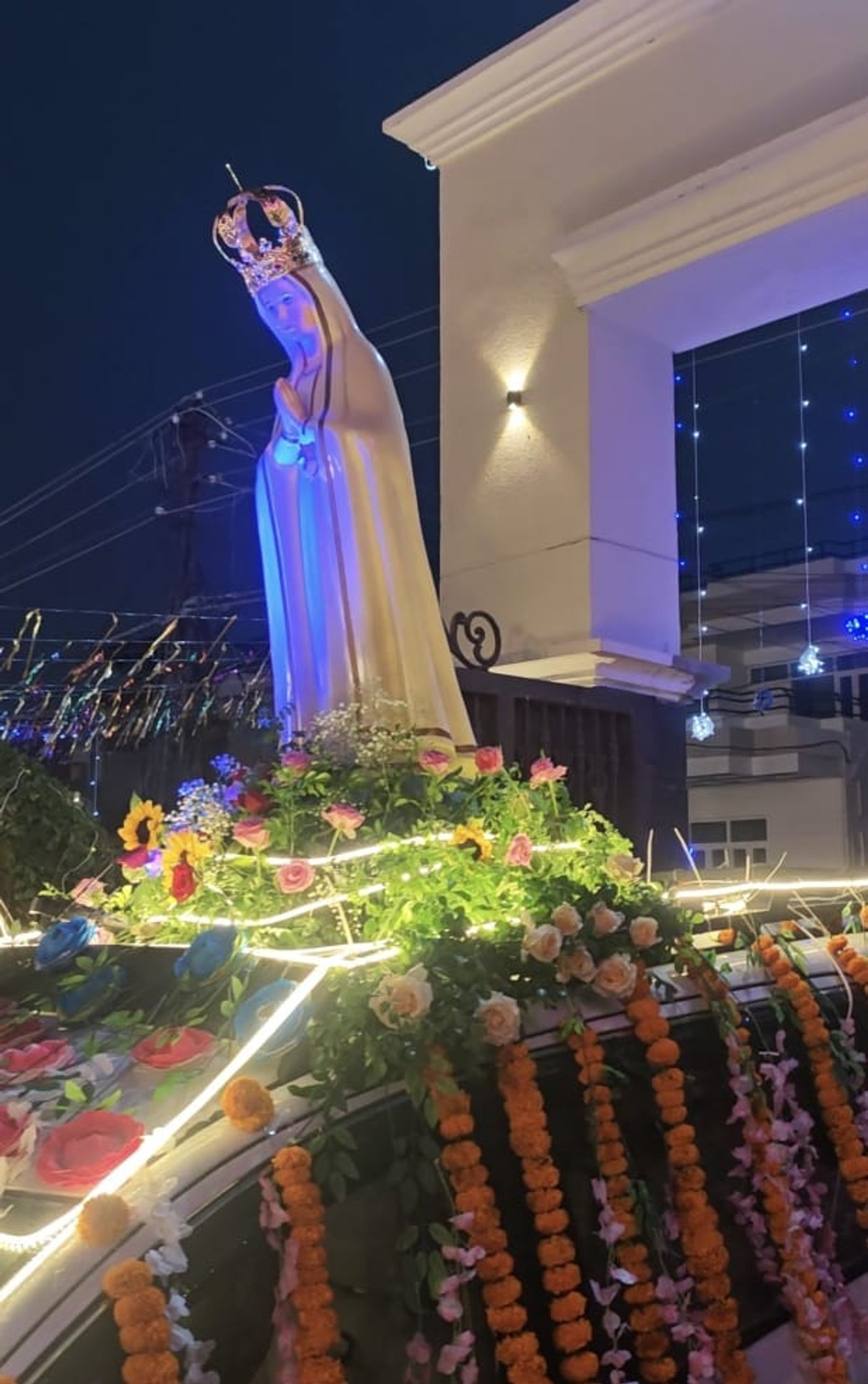 grand religious procession with the beautifully decorated statue of Our Lady of Fatima.