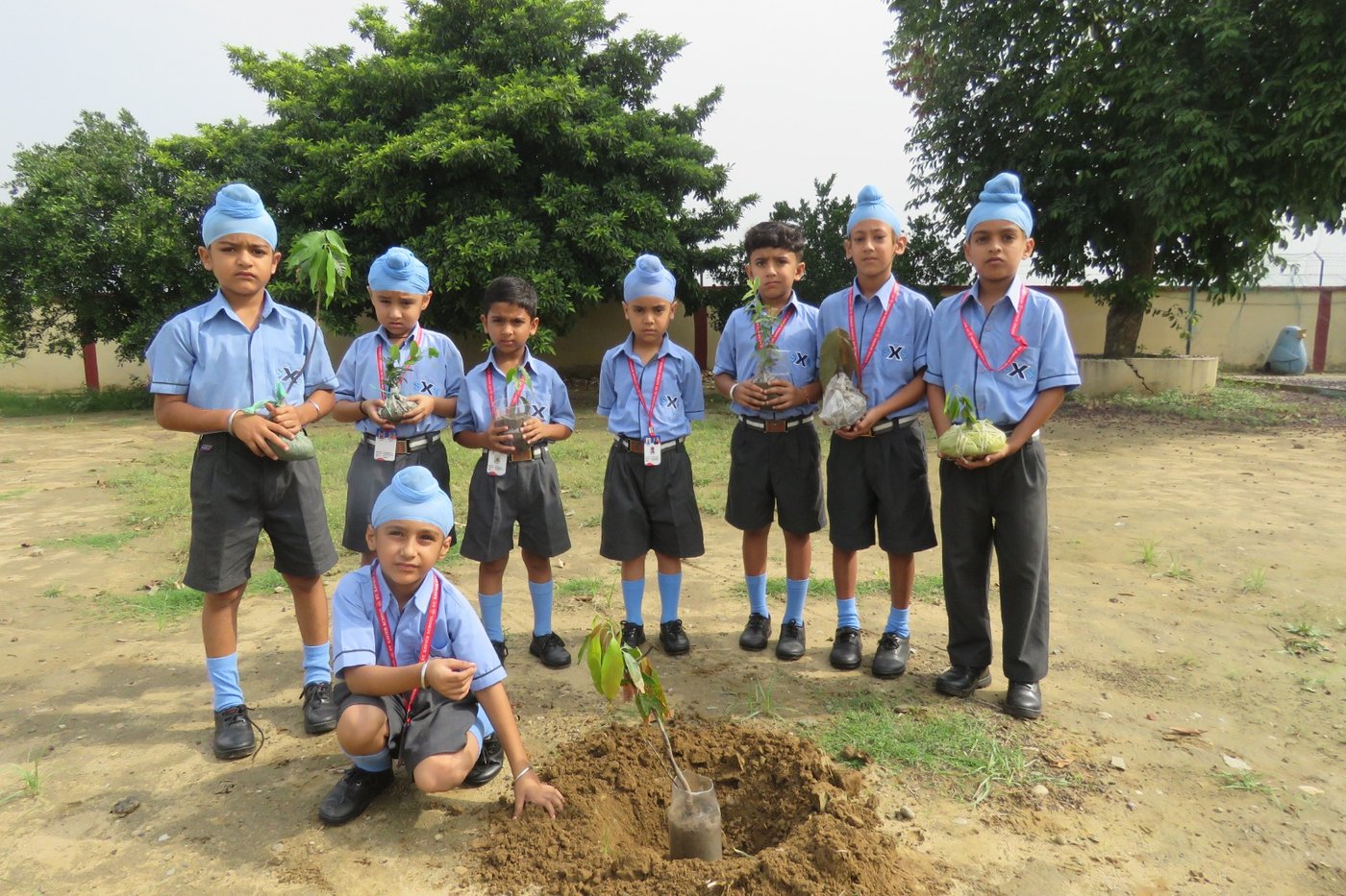 Students of Classes I–IV brought fruit saplings and planted them on the school campus