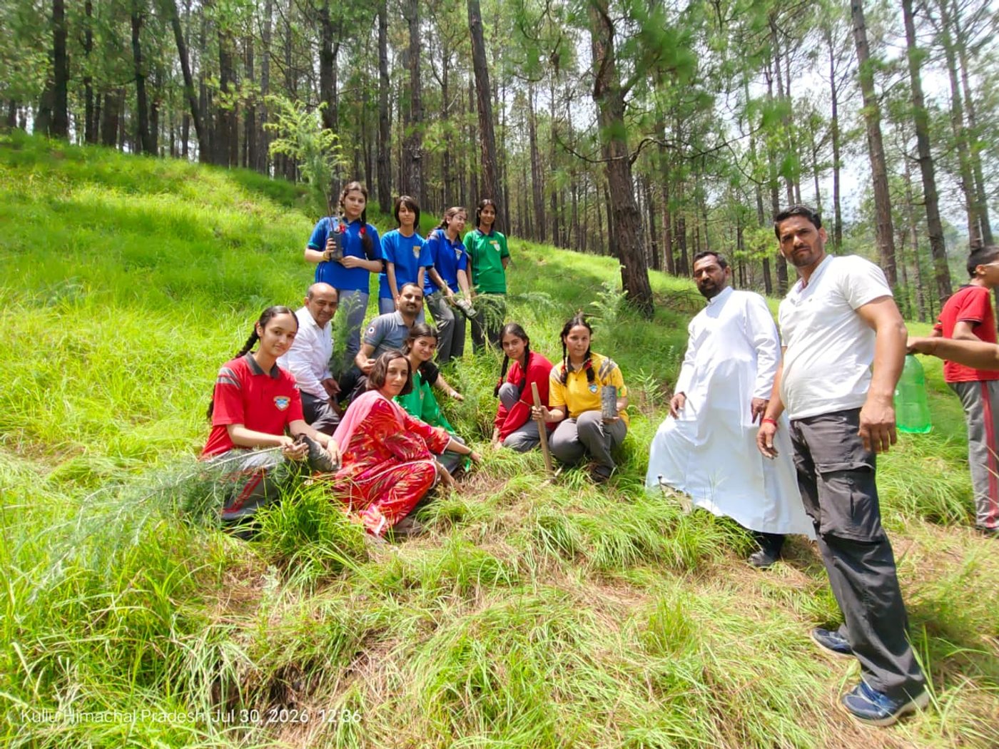 Eco-volunteers planting the sapling of Deodar Cedar meaning “Wood of the GOD”
