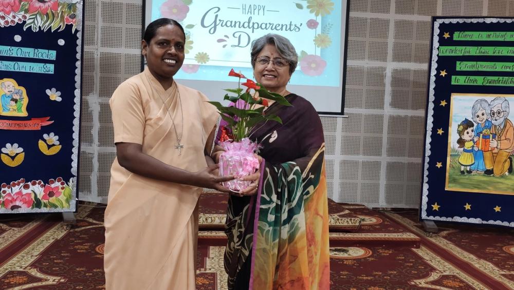 The Chief Guest, Mrs. Poonam Dhawan, former teacher of OLF, was welcomed by the Principal, Rev. Sr. Immaculate, with a green sapling
