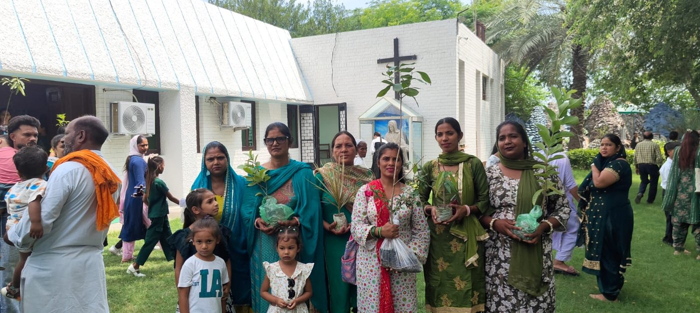 Fr. Reginald Kerketta, SFX, Parish Priest, invited every family to bring a sapling for planting and encouraged all parishioners to participate