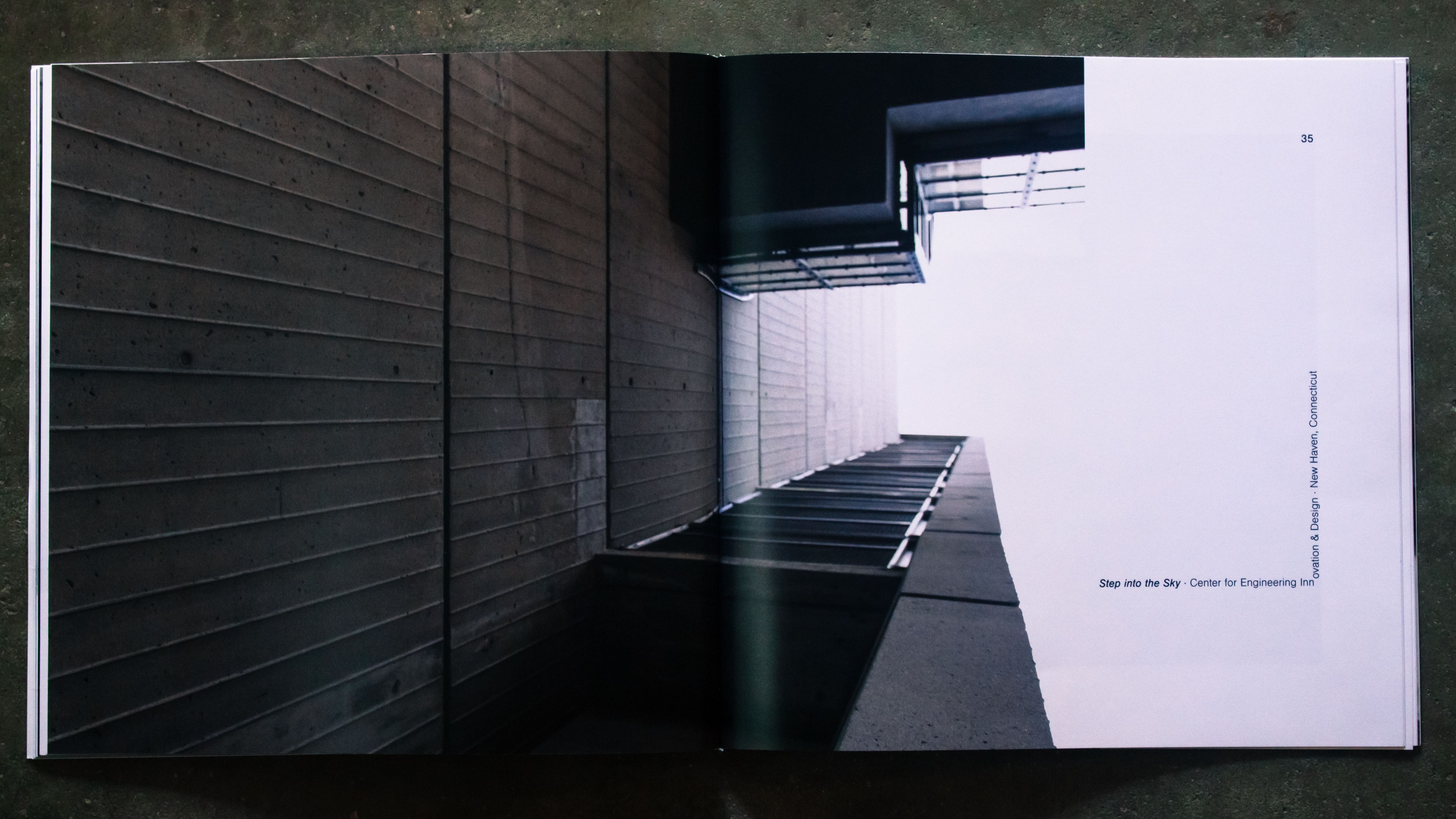 A spread with angled typography and a brutalist concrete building.