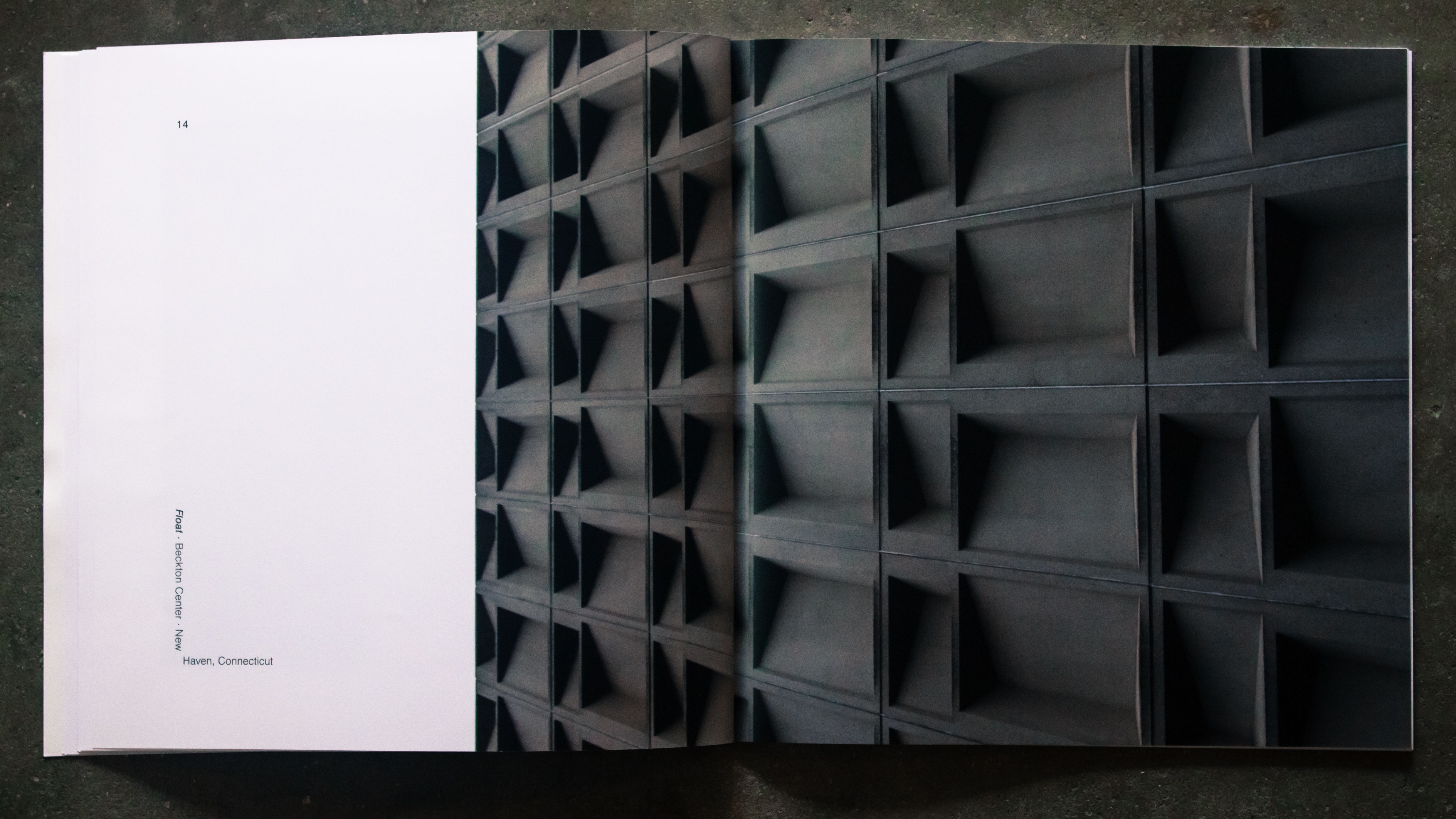 Pages from UP showing an architectural photo of a minimalist concrete building.