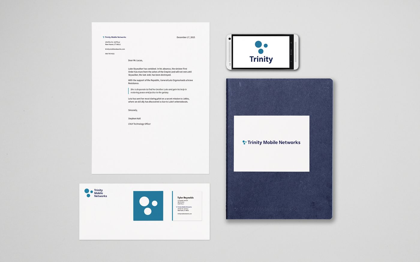 A brand identity mockup layout: letterhead, business card, and notebook with Trinity Mobile Networks branding.