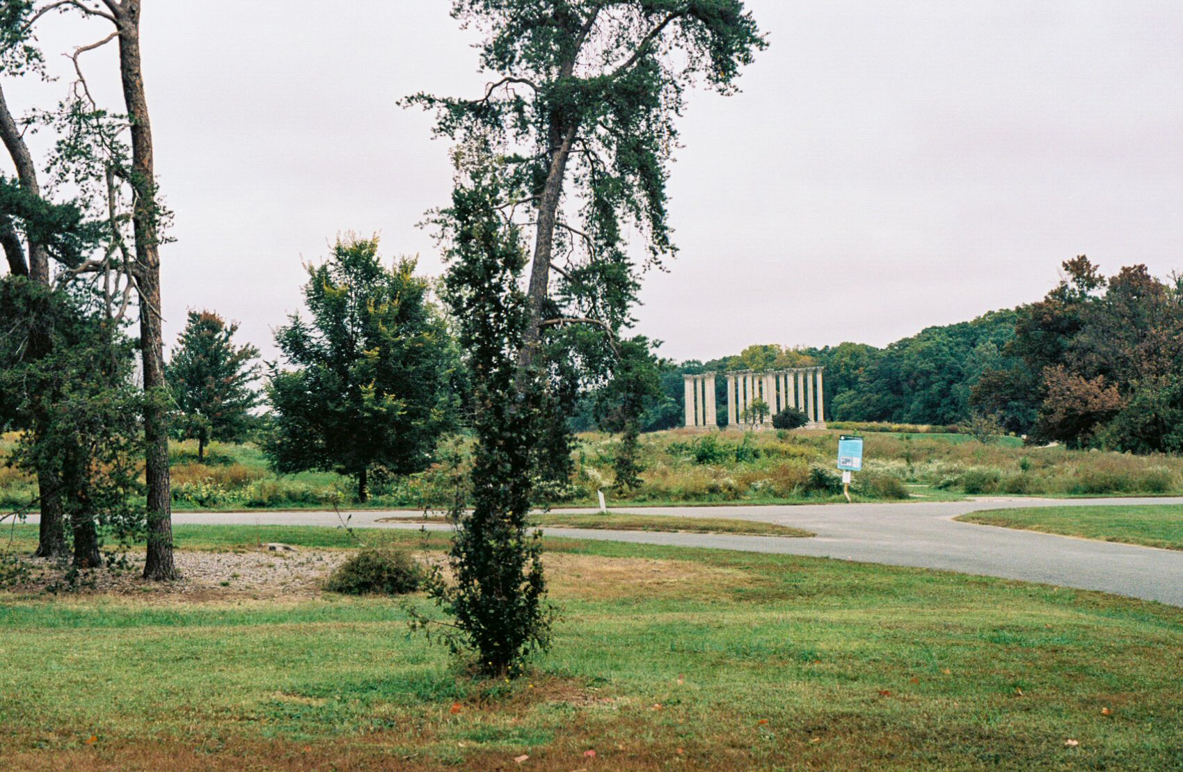 The U.S. National Arboretum. Grass and trees make up the foreground, while the National Capitol Columns stand in the distance.