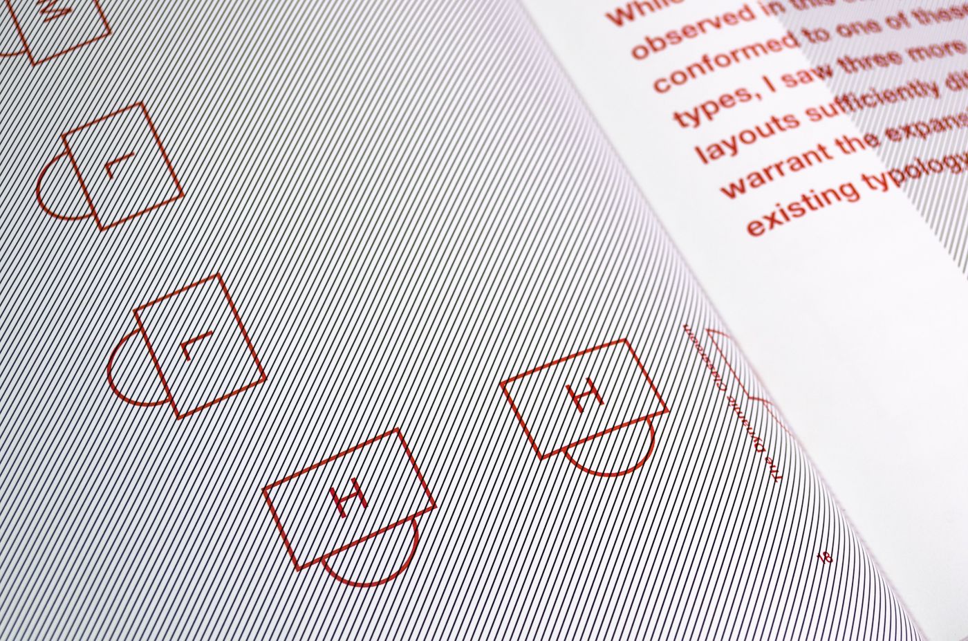 Detail of spread from The Dynamic Classroom. Thin black diagonal lines cover the page on the left. A diagram of classroom chairs is overprinted in red ink. The page on the right, which is out of focus, has text printed in red.