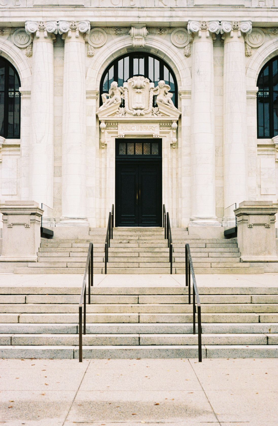 Classic architecture: the front steps and door of the Carnegie Library and Apple Store in Washington, DC
