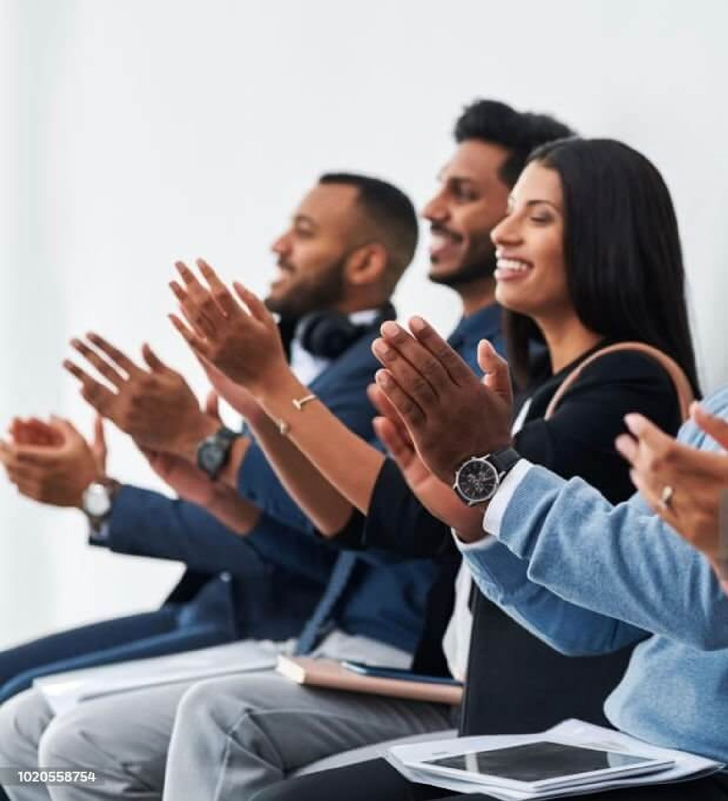 A group of happy employees celebrating together with strong employer branding