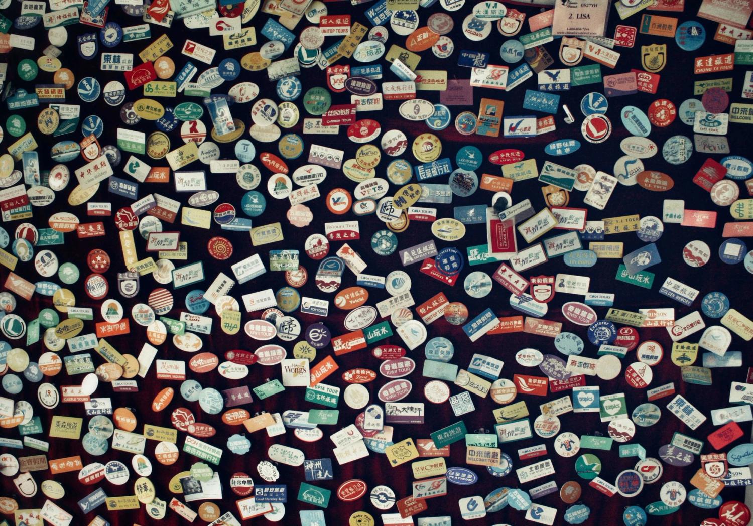 a lot of international logos laying on a desk