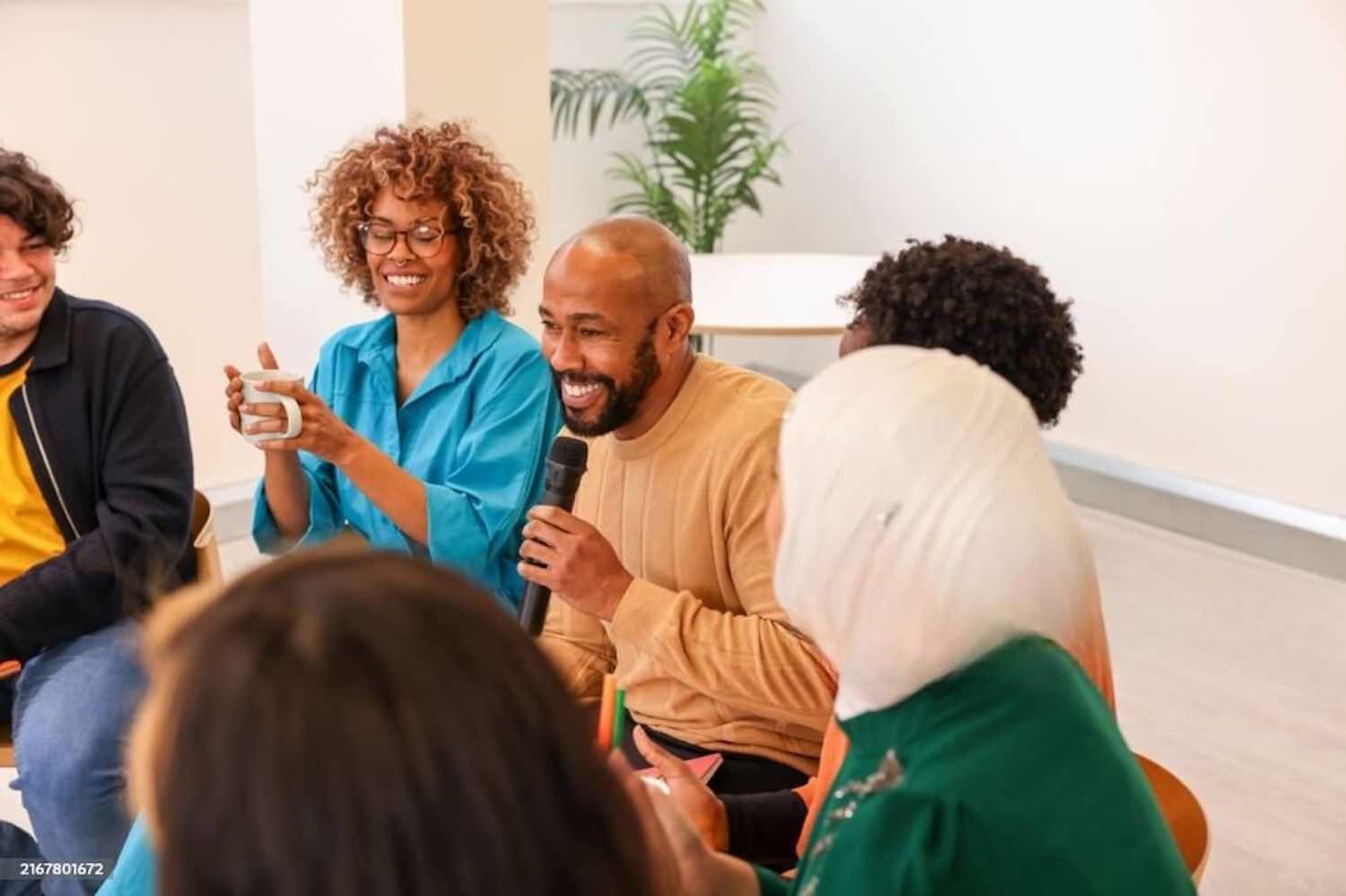 Startup team sitting together, collaborating and building community connections.