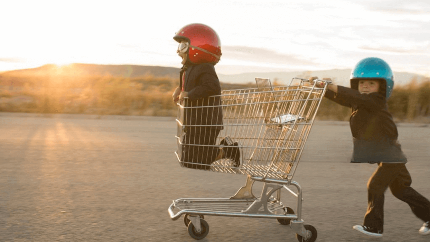 Two kids play with a shopping cart, symbolizing a fun and dynamic go-to-market (gtm) strategy in action.