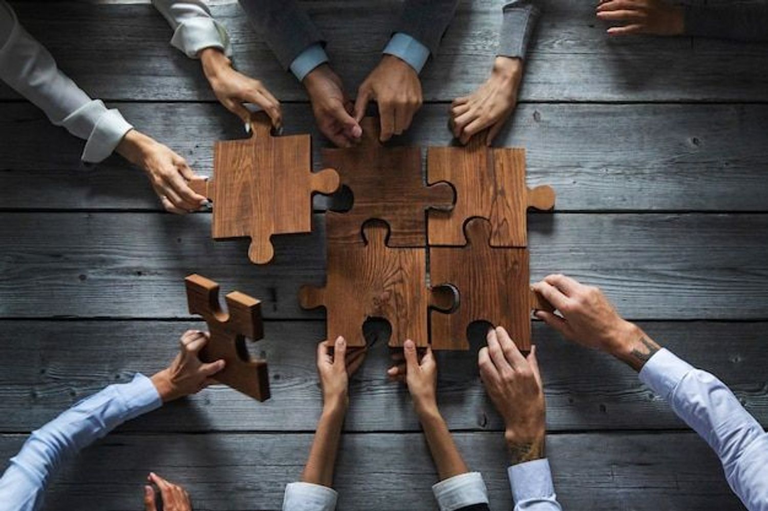 Puzzle pieces fitting together, symbolizing accurate startup valuation for a successful exit.