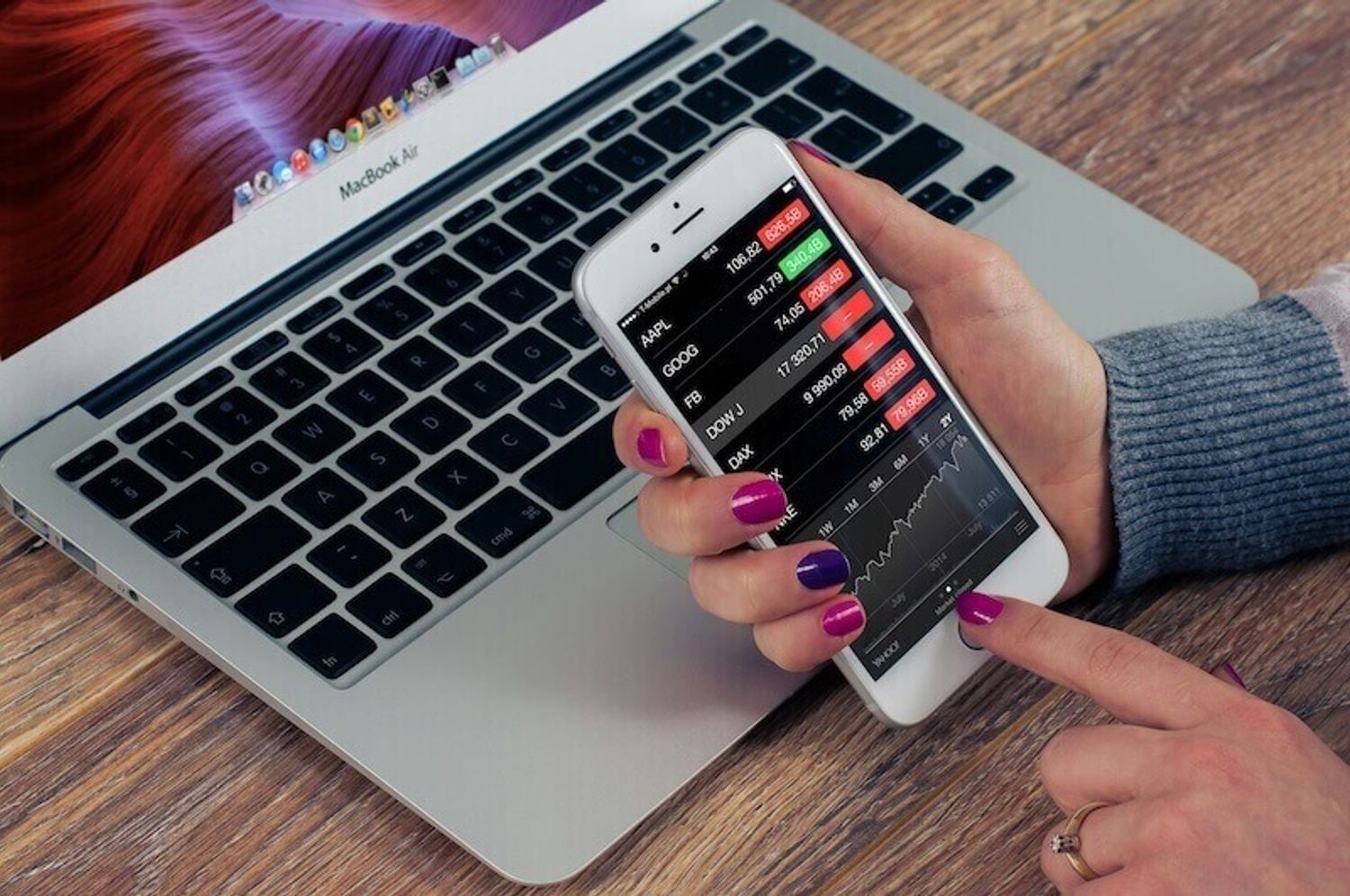 A person struggles with accounting work on their phone, wonders about hiring a startup accountant